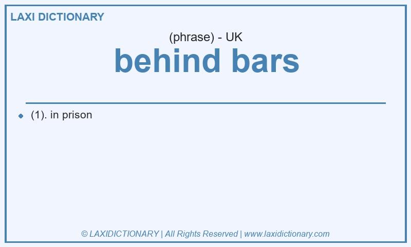 Definition behind bars in British English