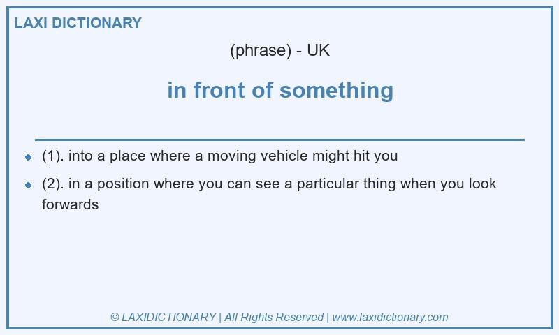 Definition in front of something in British English