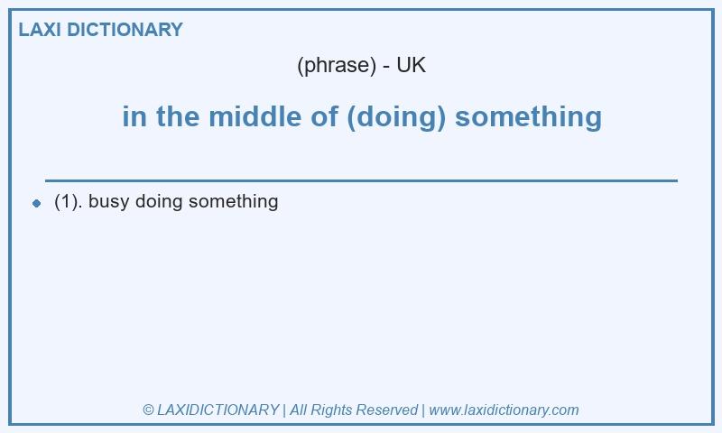 Definition in the middle of (doing) something in British English